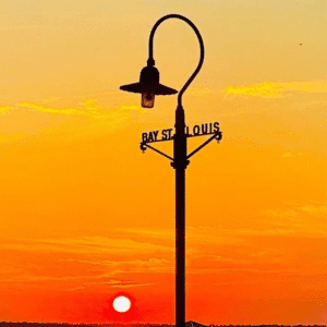 Bay St Louis Street Light Bay St. Louis street lamp at sunset with pier and orange sky
